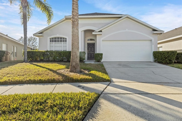 ranch-style home with a garage and a front lawn