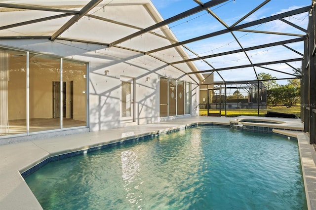 view of swimming pool with a lanai, an in ground hot tub, and a patio