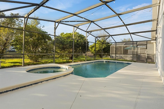 view of swimming pool featuring glass enclosure, an in ground hot tub, and a patio