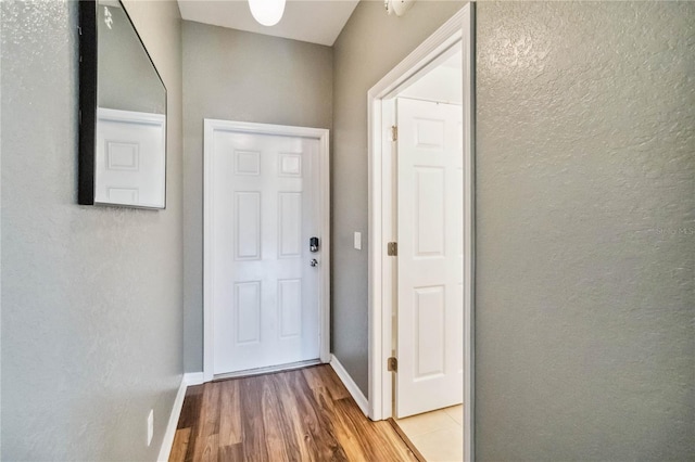 doorway with light hardwood / wood-style floors