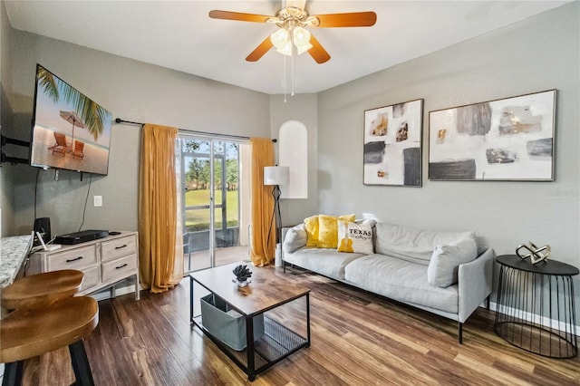 living room featuring hardwood / wood-style flooring and ceiling fan