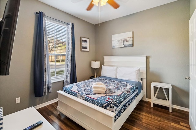 bedroom with ceiling fan and dark hardwood / wood-style floors