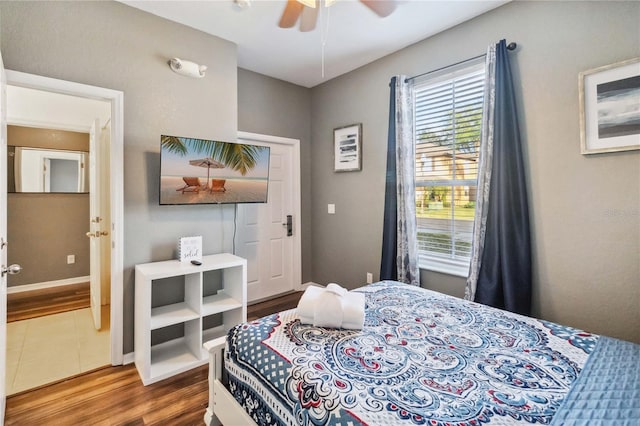 bedroom with ceiling fan and hardwood / wood-style flooring