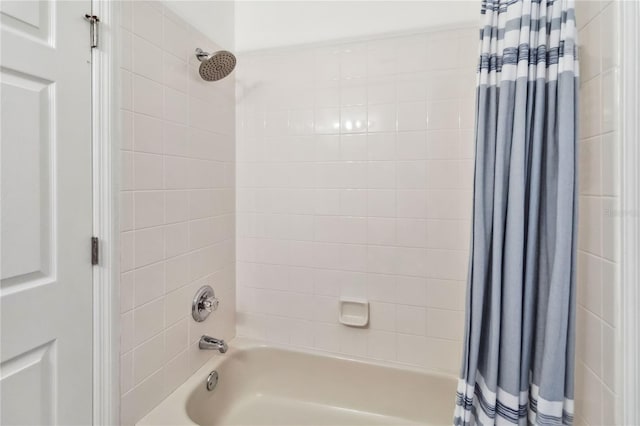 bathroom with shower / bath combination with curtain