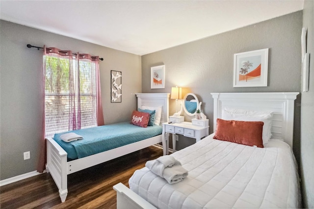 bedroom featuring dark hardwood / wood-style flooring