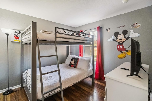 bedroom featuring dark wood-type flooring