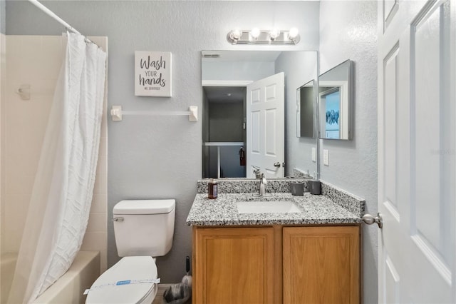 full bathroom with vanity, toilet, and shower / bath combo with shower curtain