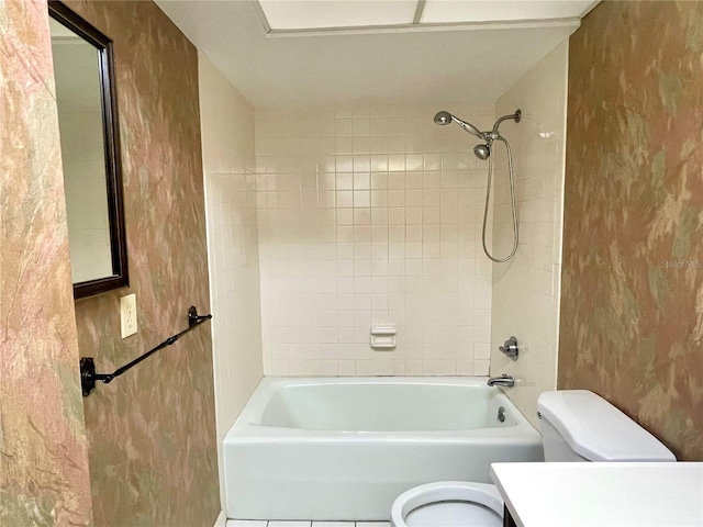 full bathroom featuring vanity, toilet, and tiled shower / bath