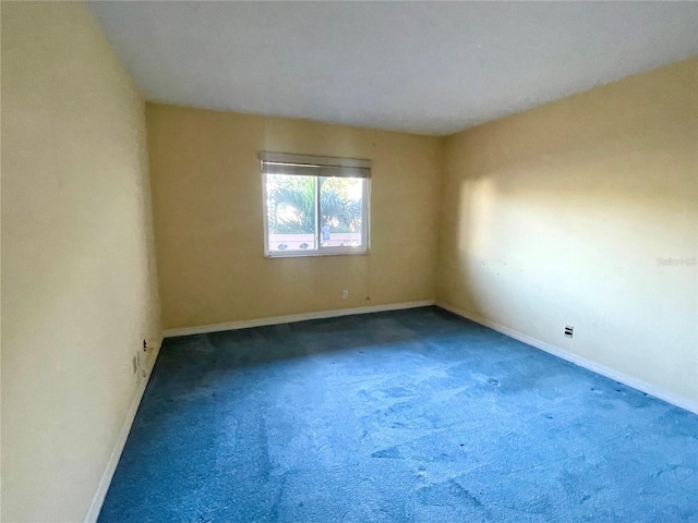 spare room featuring carpet