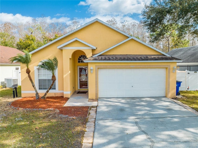 view of front of house featuring central AC and a garage