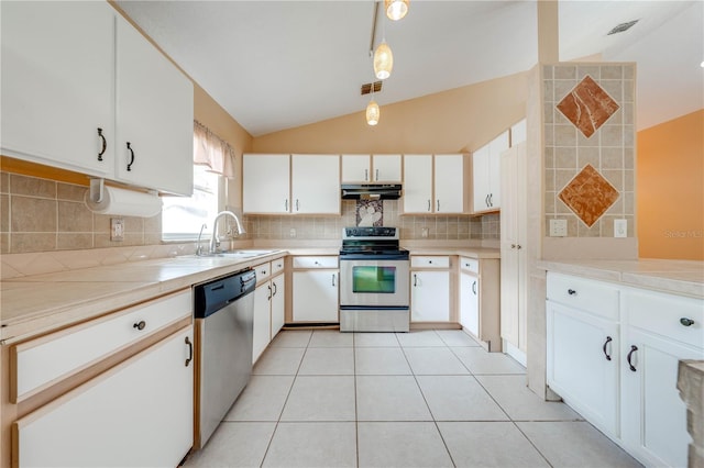 kitchen with hanging light fixtures, appliances with stainless steel finishes, white cabinetry, and sink