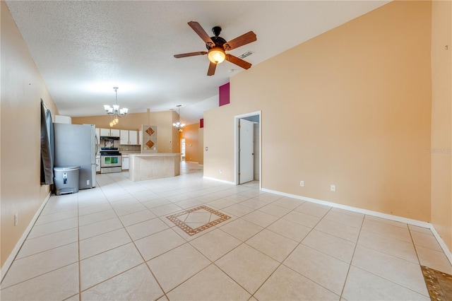 unfurnished living room featuring ceiling fan with notable chandelier, light tile patterned floors, a textured ceiling, and lofted ceiling