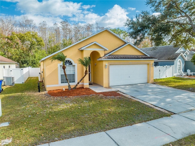 view of front of home featuring central air condition unit, a front yard, and a garage