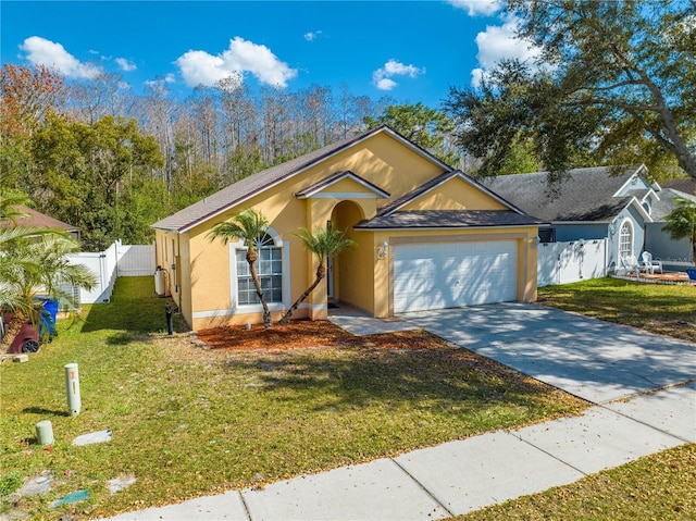 view of front of house featuring a front lawn and a garage