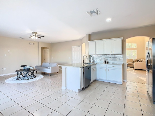 kitchen with sink, kitchen peninsula, ceiling fan, white cabinetry, and stainless steel appliances