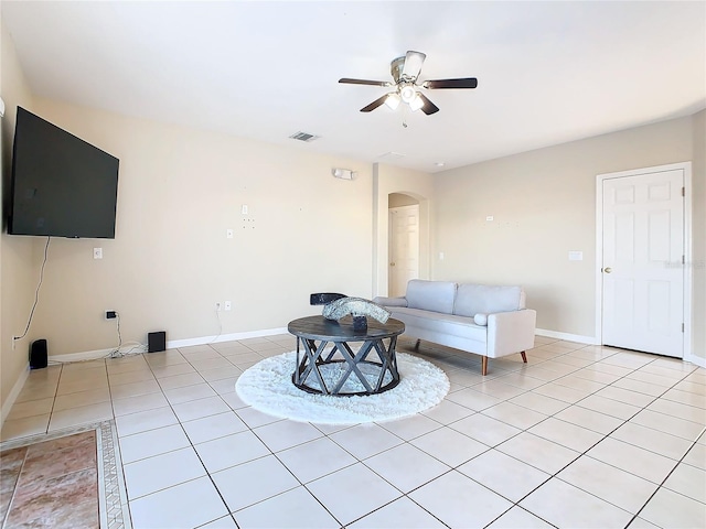 unfurnished living room with ceiling fan and light tile patterned floors