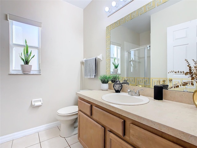 bathroom with toilet, vanity, tile patterned floors, and an enclosed shower