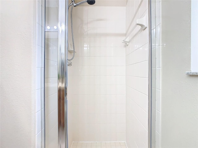 bathroom featuring an enclosed shower