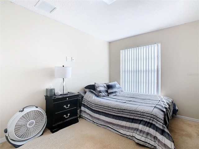 bedroom featuring light colored carpet