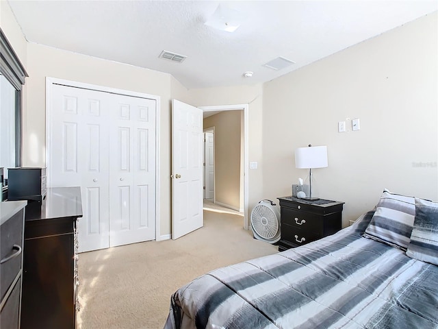 carpeted bedroom featuring a closet