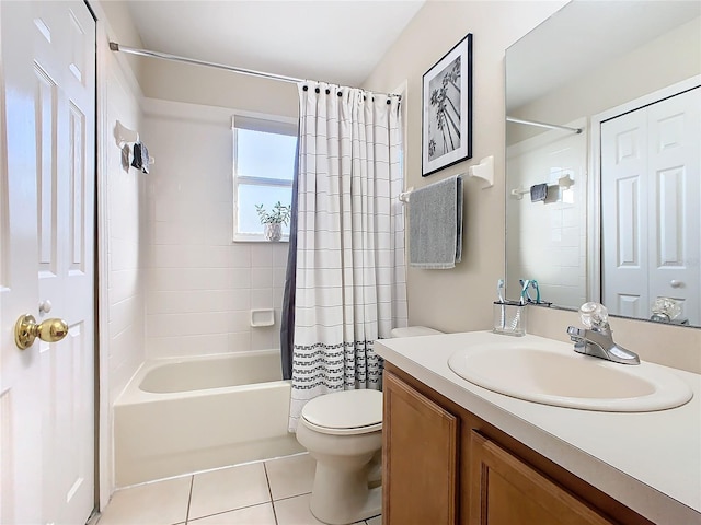 full bathroom with tile patterned floors, vanity, toilet, and shower / bath combo with shower curtain