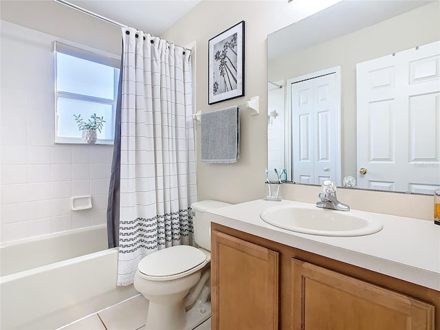 full bathroom featuring tile patterned flooring, shower / bath combo, toilet, and vanity