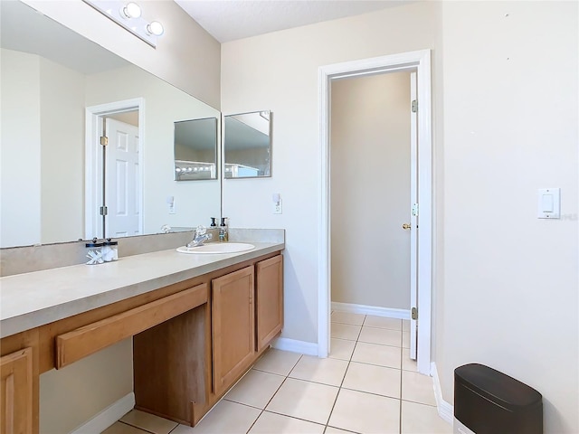 bathroom featuring tile patterned flooring and vanity