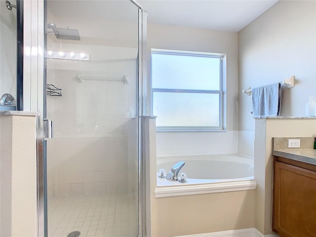 bathroom with plus walk in shower and vanity