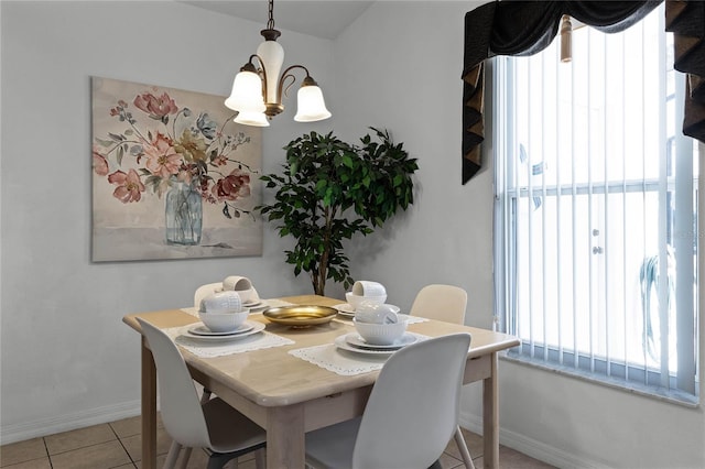 dining space featuring a chandelier and light tile patterned floors