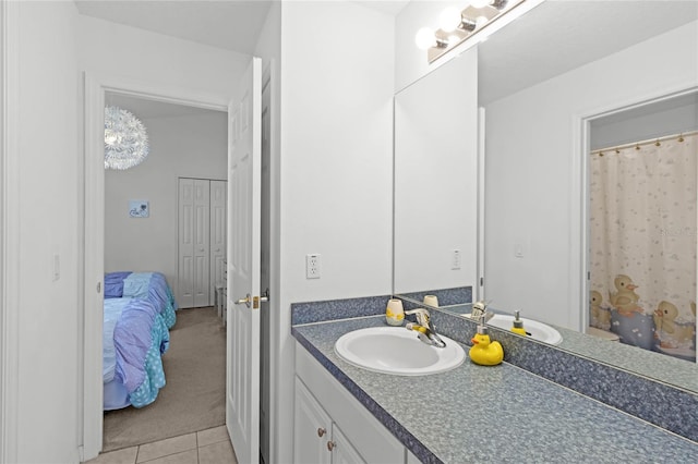 bathroom featuring tile patterned flooring and vanity