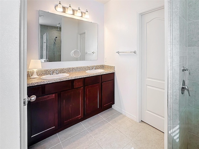 bathroom with tile patterned flooring, vanity, and an enclosed shower