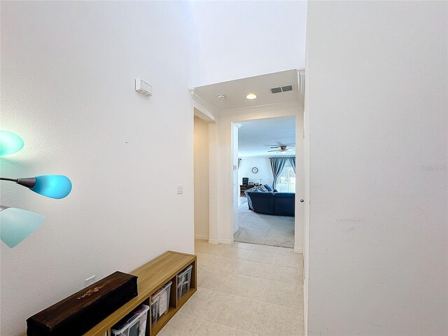 hallway featuring crown molding