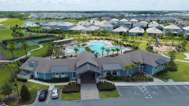 birds eye view of property with a water view