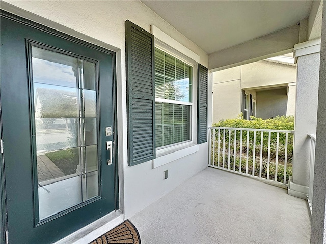 entrance to property with a porch