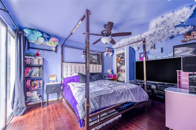 bedroom featuring hardwood / wood-style flooring and ceiling fan