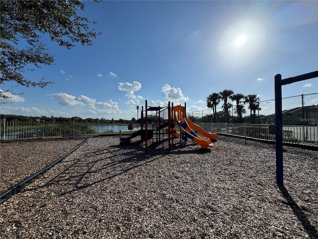 view of jungle gym with a water view