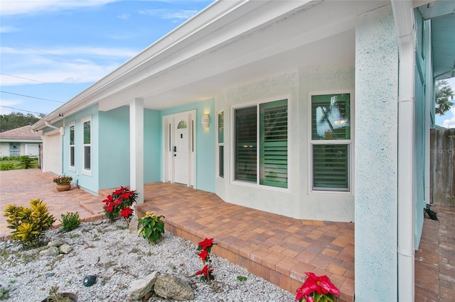 doorway to property featuring a patio