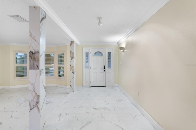 foyer entrance featuring crown molding and a textured ceiling