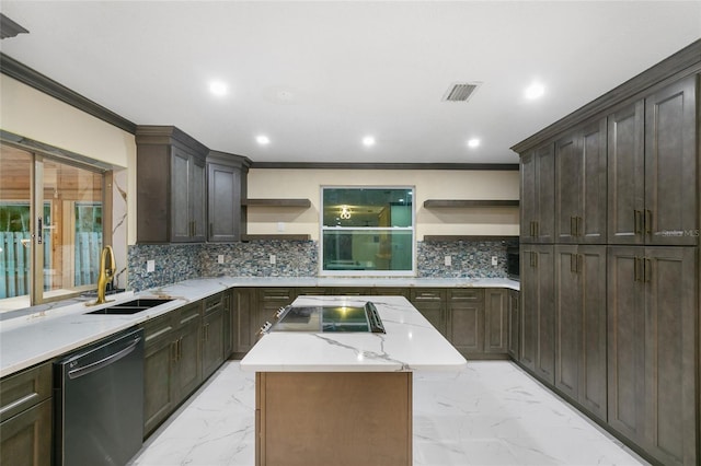 kitchen with a kitchen island, sink, ornamental molding, light stone counters, and black appliances