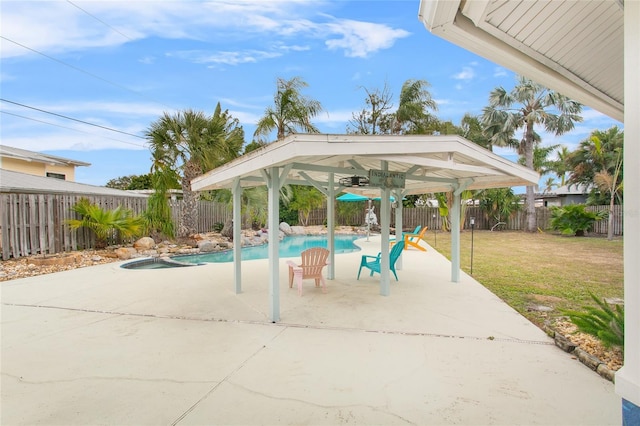 view of patio / terrace with a fenced in pool