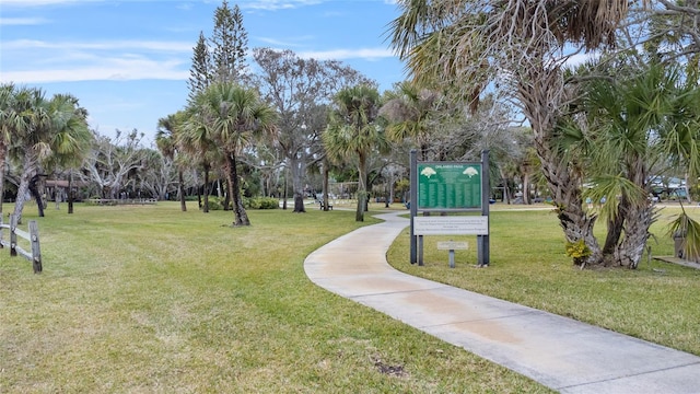 view of property's community featuring a yard