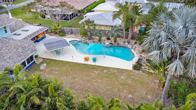 view of swimming pool with a lawn and a patio