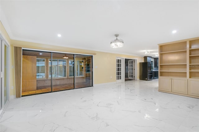 interior space featuring crown molding and french doors