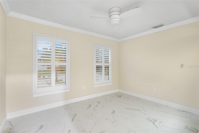 spare room featuring crown molding and ceiling fan