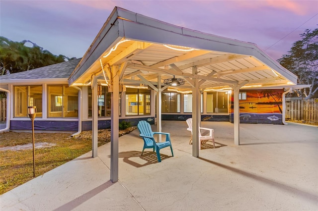 view of patio terrace at dusk