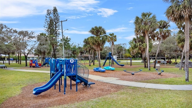 view of playground with a lawn