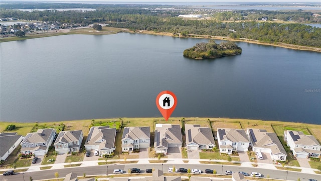 birds eye view of property with a water view