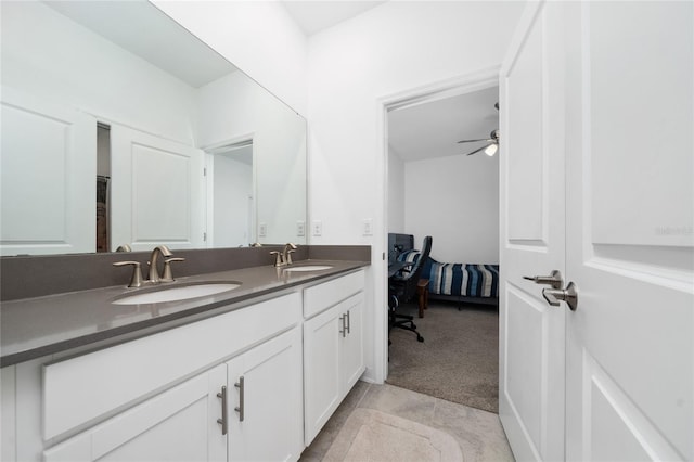 bathroom featuring tile patterned floors, ceiling fan, and vanity