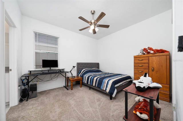 bedroom featuring ceiling fan and light carpet