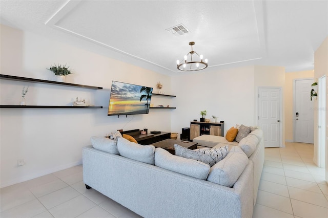 tiled living room featuring a notable chandelier